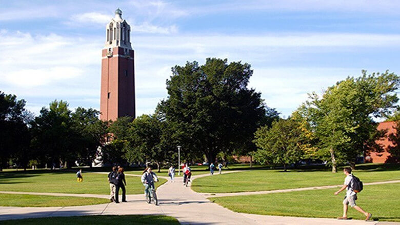 SDSU students walking by Coughlin Campanile